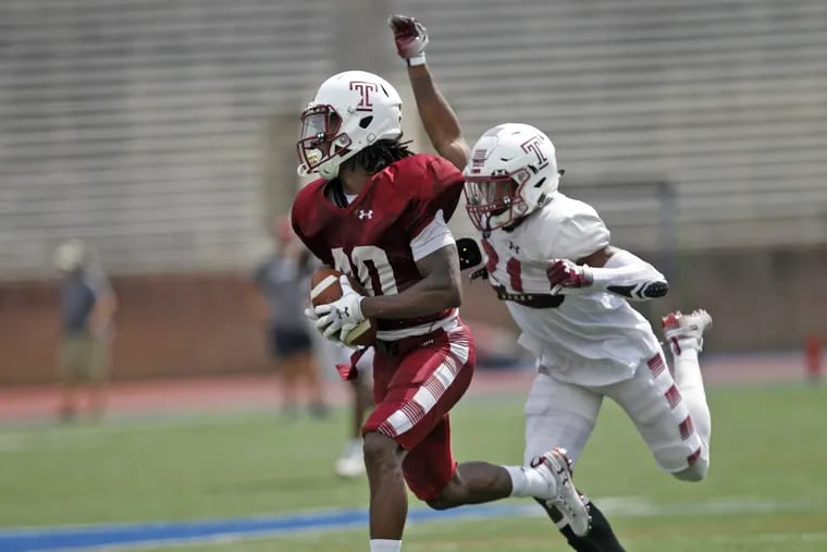 Temple's Freddie Johnson left and Ty Mason in game action during a Temple football team scrimmage, Saturday Aug. 18, 2018 in Philadelphia Pa. ( H. Rumph Jr / For the Inquirer )