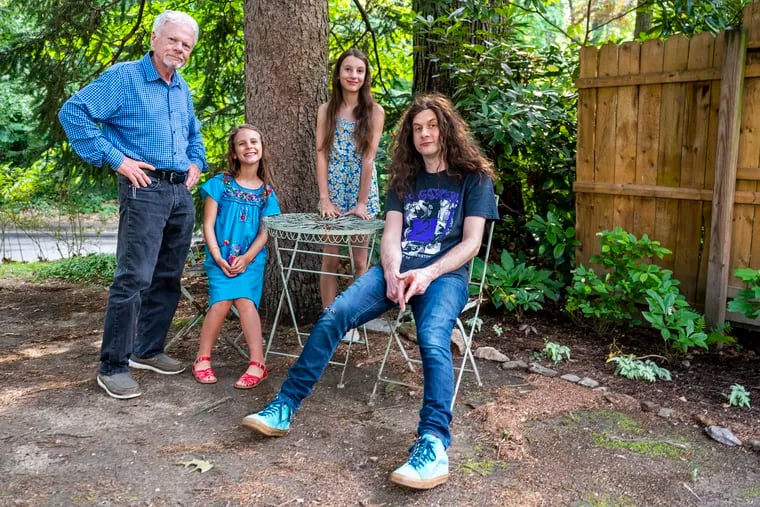Kurt Vile with his father, Charlie, and his daughters Delphine (left) and Awilda, who posed with him on the cover of his latest album at his home in Mount Airy.