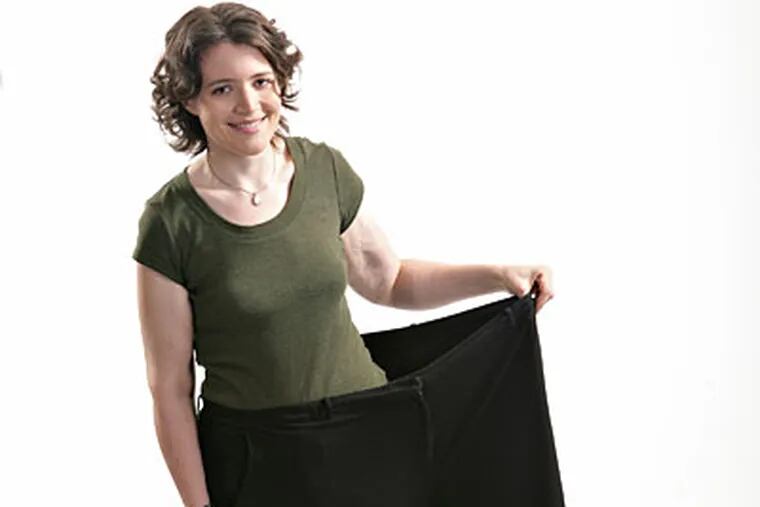 Jennette Fulda standing in one leg of her "fat pants." Fulda is the author of "Half-Assed: A Weight-Loss Memoir," about her 200-pound weight loss. (AP Photo/Jennette Fulda)