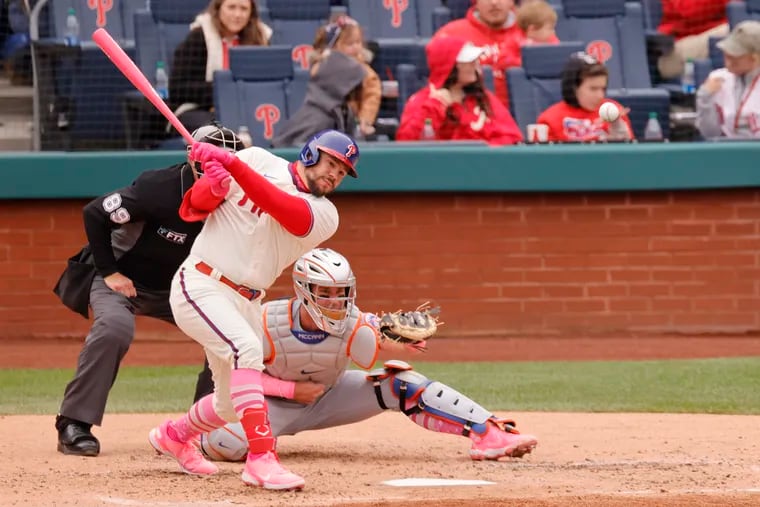 Phillies outfielder Kyle Schwarber hits a single in the third inning of Game 1 against the Mets at Citizens Bank Park.