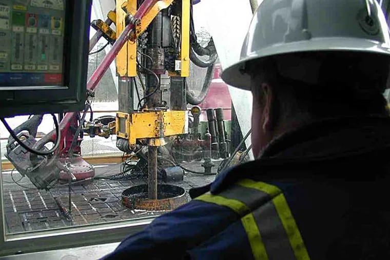 File photo: Tom Jackson, supervisor of a Canadian crew, monitors the progress of a Marcellus Shale natural-gas-well drilling operation for Anadarko Petroleum Corp. on leased ground in Pennsylvania's Tiadaghton State Forest.