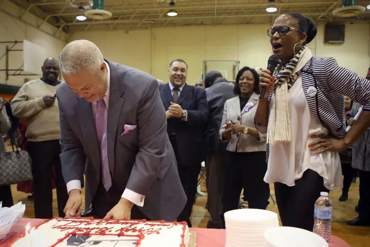 Anthony Williams, left, cuts his birthday cake while his wife, Shari Williams cheers behind him at a campaign event in Philadelphia on Saturday, February 28, 2015 ( STEPHANIE AARONSON / Staff Photographer )
