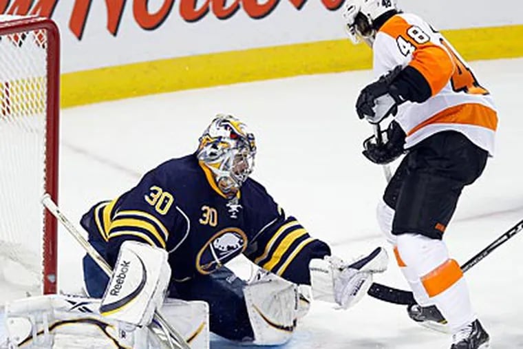Sabres goalie Ryan Miller gloves the puck against the Flyers Danny Briere in Game 4. (Yong Kim/Staff Photographer)
