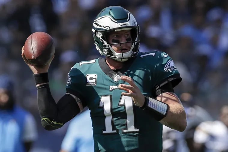 Eagles quarterback Carson Wentz holds the football against the Los Angeles Chargers on Sunday.