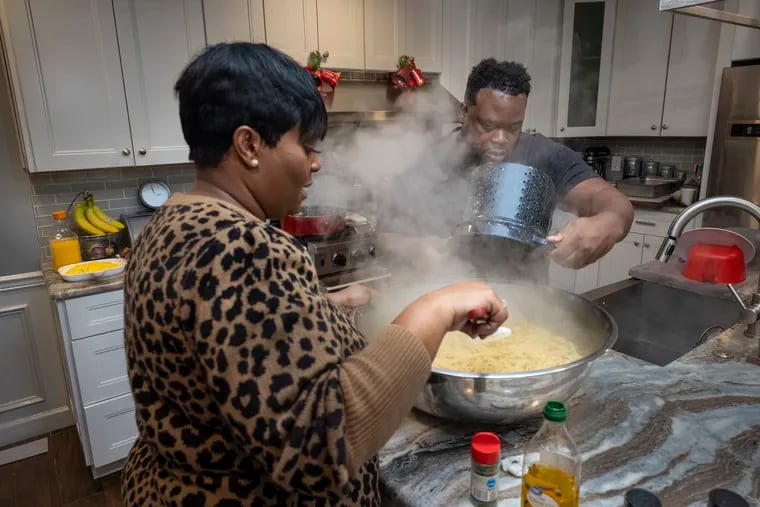 James and Carleen Roberts cook in their home where they host a Youtube channel. They and other volunteers prepare meals they will serve Saturday at a homeless shelter in Camden.