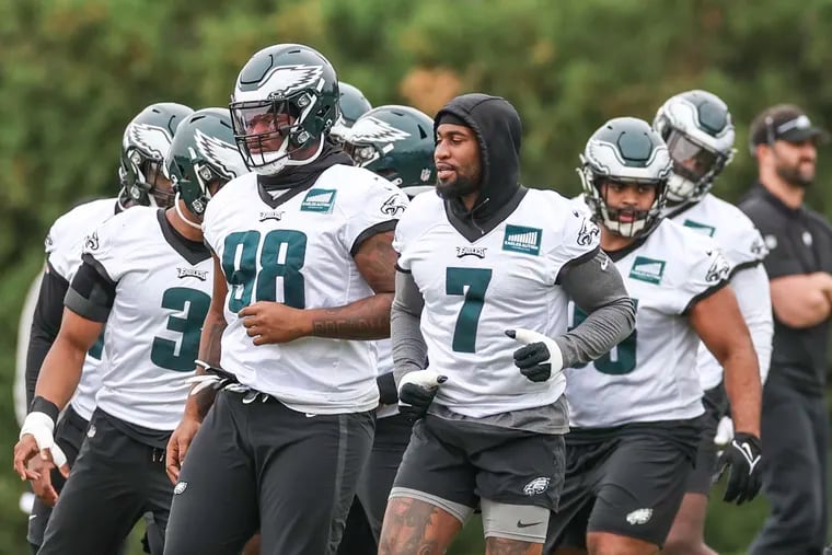 Linebacker Haason Reddick (7) warms up next to defensive tackle Jalen Carter during Eagles practice at the NovaCare Complex on Thursday.