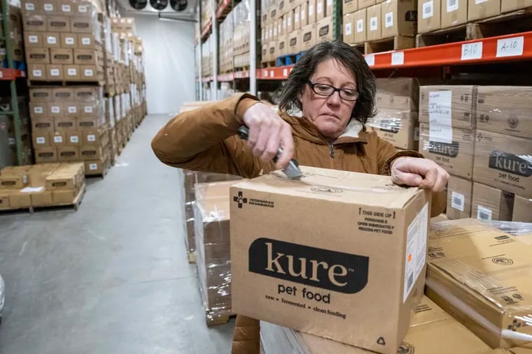 Jacqueline Hill, a consultant with Kure pet food, in a warehouse owned by Ervin King, owner of Rocky Ridge Goat Dairy. The cold-storage facility houses Kure Pet Food, but a legal battle with another raw pet-food company has forbidden the company from selling.
