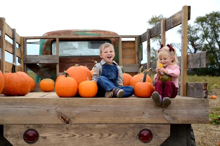 Henry and Charlotte Reese pose at one of the many photo ops at Shady Brook Farm in Yardley.
