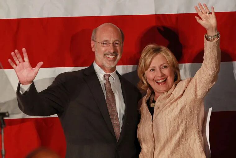 MICHAEL BRYANT / STAFF PHOTOGRAPHER Tom Wolf gets a boost from Hillary Clinton at the National Constitution Center yesterday.