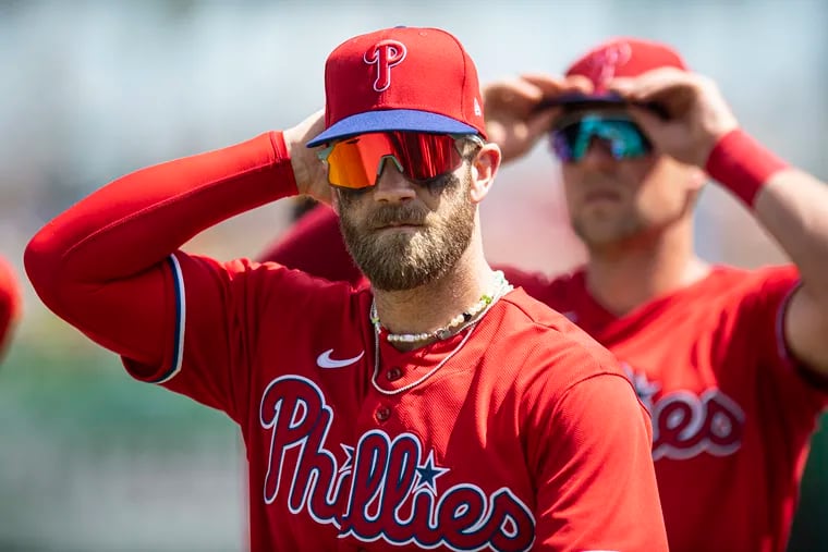 Bryce Harper adjusts his hat during a game against the Toronto Blue Jays in Clearwater, Fla., on March 19.