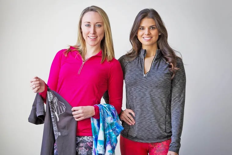 Erin Moffitt and Ashley Revay (right), both Drexel University seniors and co-founders of Chakra Fitwear, model some of their clothing on December 4, 2014. ( ALEJANDRO A. ALVAREZ / STAFF PHOTOGRAPHER )