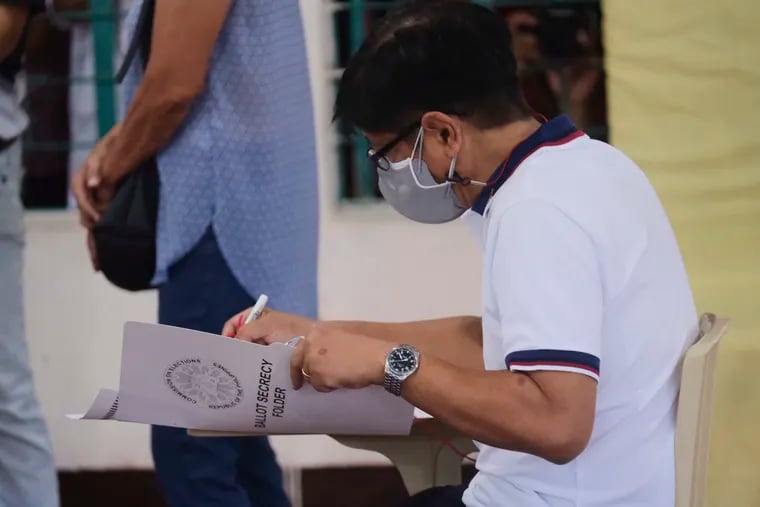 Presidential candidate Ferdinand Marcos Jr., the son of the late dictator, votes at a polling center in Batac City, Ilocos Norte, northern Philippines on Monday.
