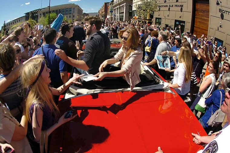 Actors John Krasinski and Jenna Fischer greet loyal fans at Scranton's &quot;Office&quot; parade. The NBC comedy, which poked fun at the city for nine years, airs its series finale May 16.
