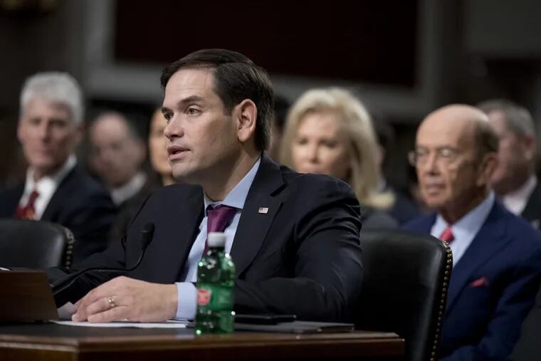 Sen. Marco Rubio, R-Fla., speaks in support to Commerce Secretary-designate Wilbur Ross, right, on Capitol Hill in Washington, Wednesday, Jan. 18, 2017, during Ross' confirmation hearing before the Senate Commerce Committee.