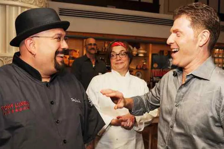 A tasty lineup turned out at Williams-Sonoma in the Shops at the Bellevue on Wednesday for a Bobby Flay book-signing. Flay (right) and Tony Luke Jr. sandwiched chef Margaret Schaum of Williams-Sonoma.