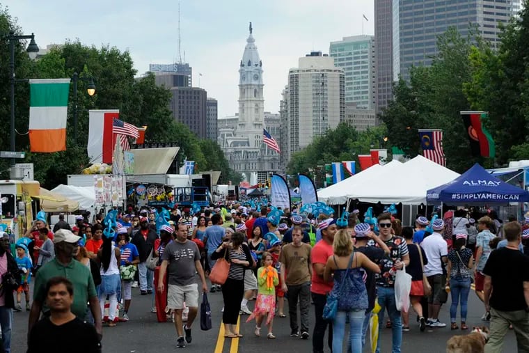 Attendees gather on the Ben Franklin Parkway during the Wawa Welcomes America Fourth of July Festival on the Ben Franklin Parkway in 2015.