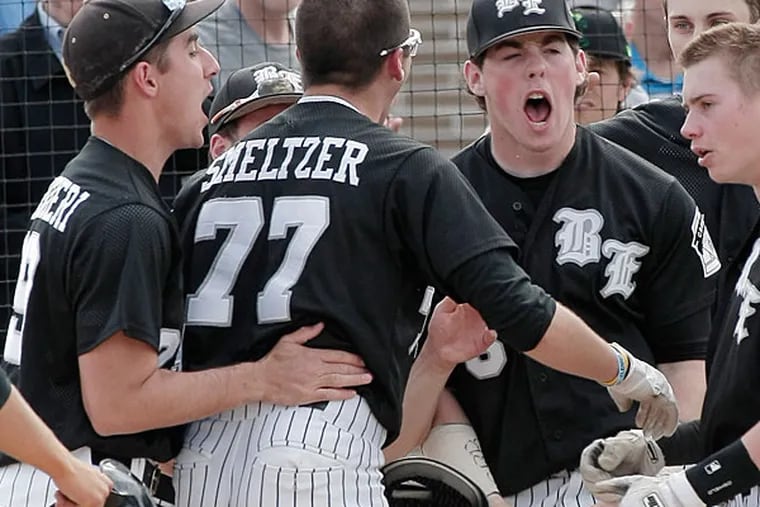 Bishop Eustace's Devin Smeltzer is greeted by teammates at home plate after he tied the game by hitting a two-run homer. (Elizabeth Robertson/Staff Photographer)