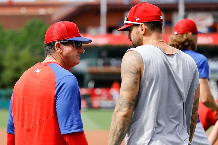 Phillies interim manager Rob Thomson talks to Nick Castellanos during warm-ups before the Phillies play the Los Angeles Angels on Friday, June 3, 2022.