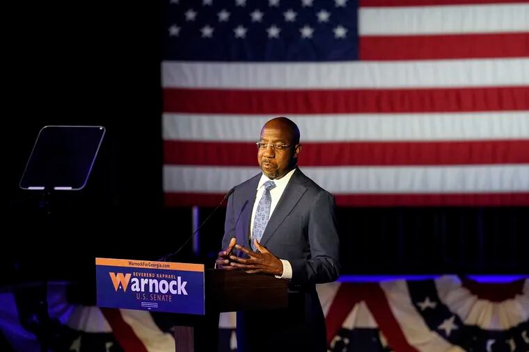 Democratic nominee for U.S Senate Sen. Raphael Warnock speaks during an election-night watch party Wednesday, Nov. 9, 2022 in Atlanta.