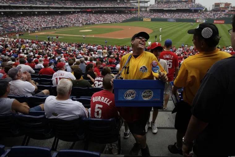 File photo: Aramark concessionaires, such as these beer vendors, are subcontractors and thus not included in the Phillies' $1 million fund to help employees.