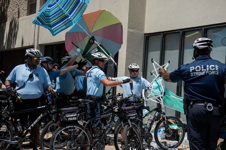 Police raid the Occupy Ice encampment outside of a Philadelphia ICE office on 8th and Cherry in Center City on Thursday, July 5, 2018. Protesters are calling for the closure of the detention center in Berks County and an end to local collaboration with federal immigration officials. Police raided their camp at about 1 p.m. Thursday afternoon.