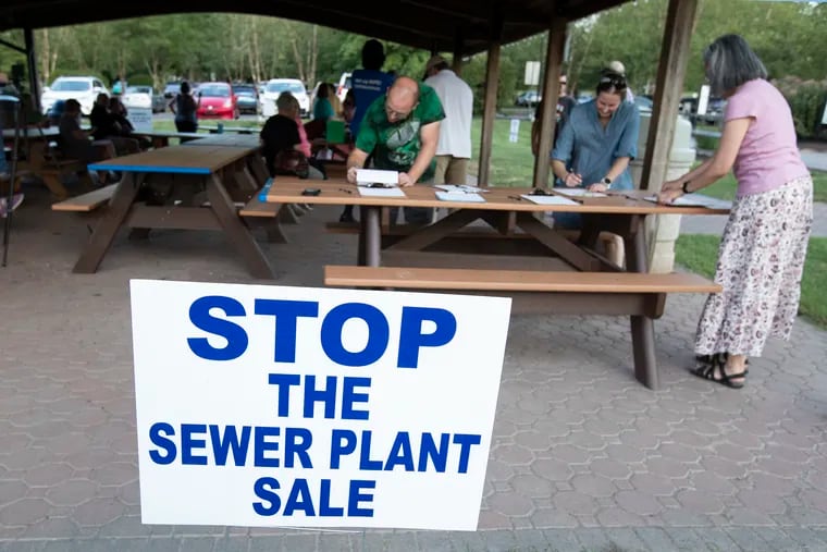 Towamencin Township residents opposed to the sale of the town's sewer system sign petitions in August for a ballot measure to change the town's charter to prohibit the sale. The ballot measure passed in November with 61% of the vote, and the group's seven candidates were elected to a commission to draft a proposed home rule charter.