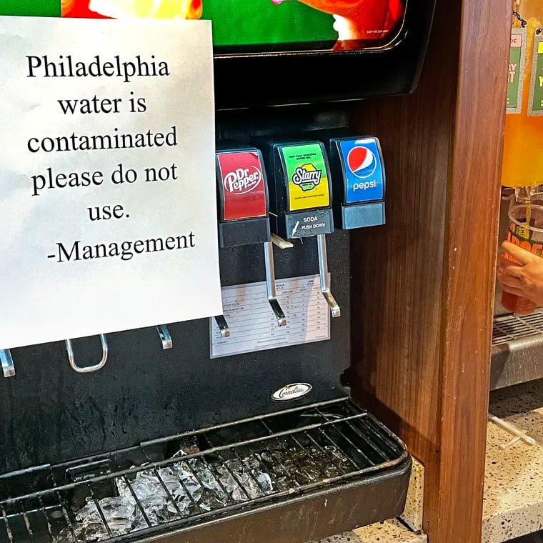 A sign advises diners not to use the water-blended fountain soda in a Center City restaurant on Sunday, March 26, 2023, after Philadelphia officials suggested residents switch to bottled water to avoid ingesting chemicals spilled into a tributary of the Delaware River in Bucks County Friday night.