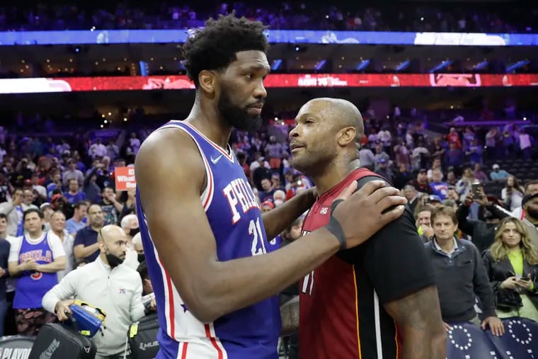 Joel Embiid with P.J. Tucker after the Sixers were eliminated from the playoffs by the Heat on May 12.