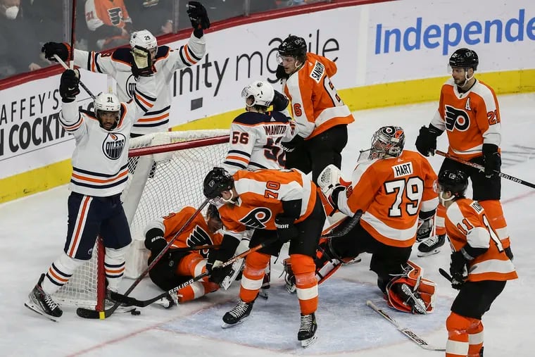 The Oilers' Evander Kane (left) celebrates his goal against the Flyers during the second period at the Wells Fargo Center.