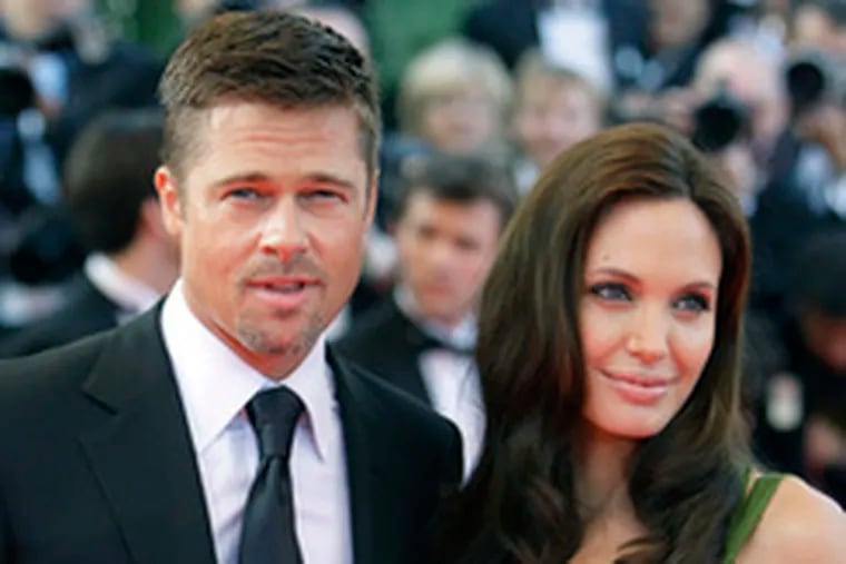 Brad and Angelina reportedly will give to charity the $11M they reportedly got for pix of their twins.