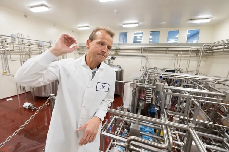 Gunner Birgisson, the chief executive officer of the Reykjavik Creamery in Newville, Pa., is surrounded by equipment used to make Icelandic yogurt called skyr. Birgisson has faced a host of legal challenges since opening his business, including a denial of a work permit by U.S. Immigration officials.