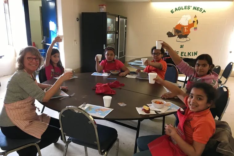 From left, Volunteer Bette Begleiter toasts with her students Dayandelis Delgado, Amariliz Irizarry, Yaslyn Garcia, Lealin Mas and Layla Centeno.