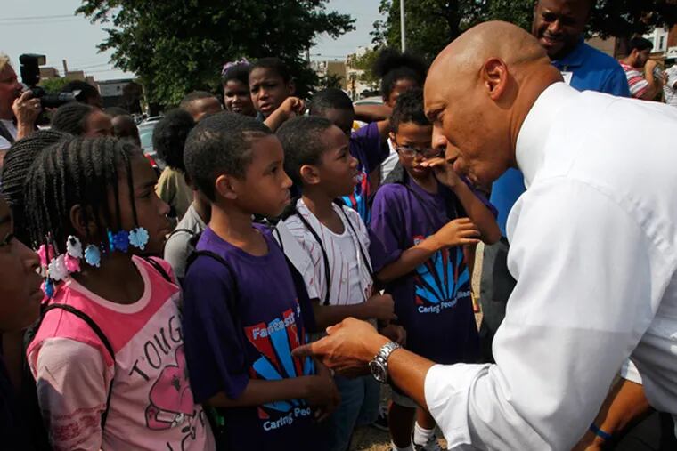 Philadelphia Public School Superintendent William Hite is shown greeting a group of children at the Back to School Extravaganza in August. An annual process called "leveling" – in which teachers are shifted around based on enrollment fluxes - is causing anxiety this year. (FILE)