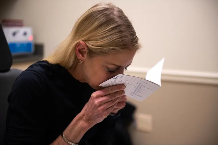 Nancy Damato tests her sense of smell at a Jefferson Health clinic, more than a year after she lost her sense of smell due to COVID.