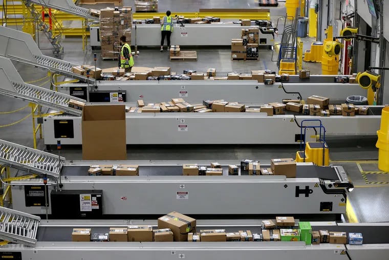 Boxed orders are sorted into transport trucks at the Amazon Fulfillment Center in West Deptford, N.J., on Friday, June 14, 2019. The robotic fulfillment center opened in September and is Amazon's fourth such site in New Jersey.