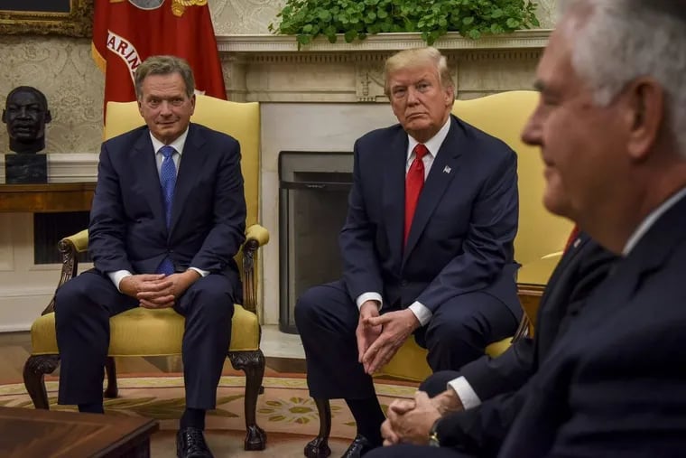 President Donald Trump, center right, with President Sauli Niinistö of Finland, left, and Secretary of State Rex Tillerson, right, in the Oval Office on Monday.