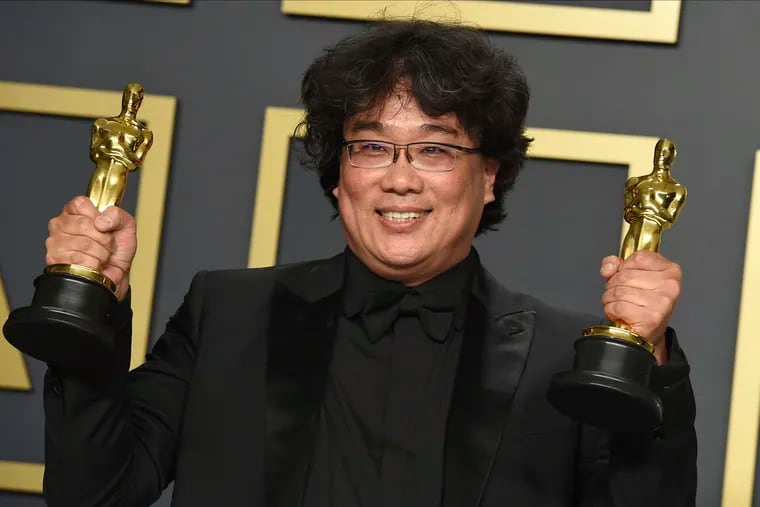 Bong Joon Ho with the awards for best director and for best international feature film for "Parasite" at the Oscars on Sunday.