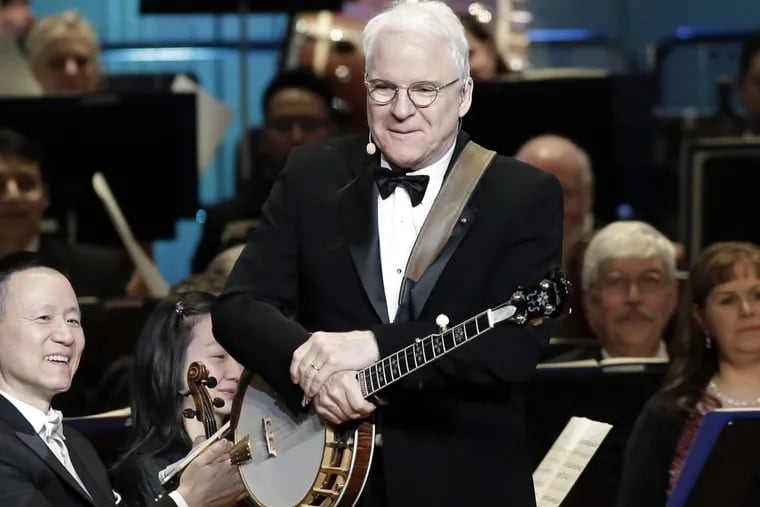 Steve Martin gets applause after playing the banjo during the 161st Academy of Music Anniversary Concert and Ball.