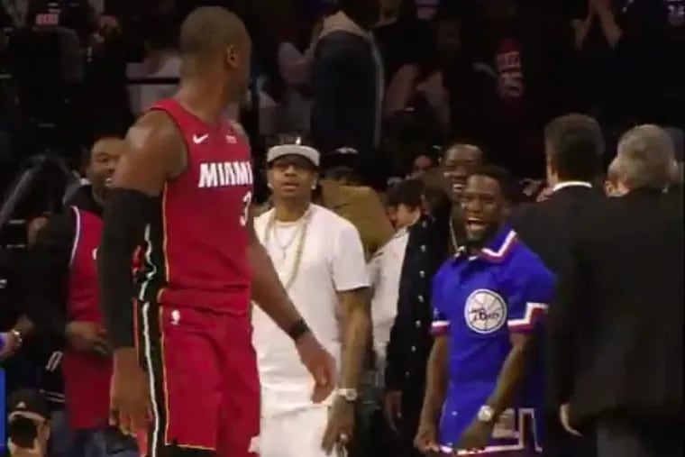 Miami Heat star Dwyane Wade and comedian Kevin Hart talk trash to one another during the Heat’s 113-103 win over the Sixers Monday night at the Wells Fargo Center.