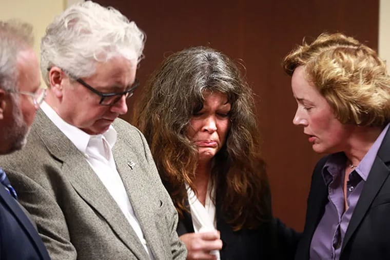 Diane and Pat Crowley are comforted by Brenda Bernot, Westown-East Goshen Regional Police Department, after giving a press conference Monday April 14, 2014. Robert Landis, a West Chester man with seven previous drunk driving arrests pleaded guilty to vehicular homicide on Monday, nearly a year after the police say he again drove drunk and caused an accident that killed their son, Liam James Crowley, 24. ( DAVID SWANSON / Staff Photographer )