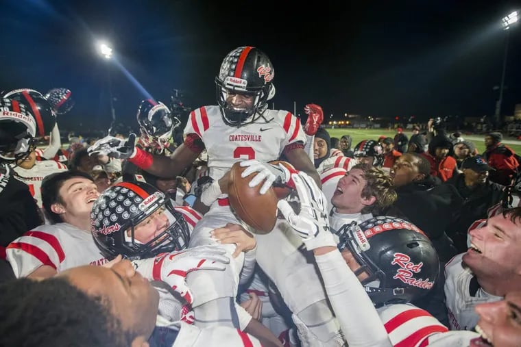 Avery Young of Coatesville is lifted up on the shoulders of his teammates after their 35-28 victory over Garnet Valley in a District 1, group 6A, championship game on Nov. 24, 2017. Young ran an interception back for the winning touchdown and intercepted another pass to seal the victory.