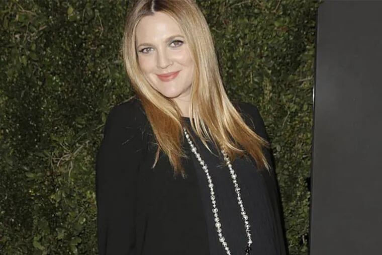 FILE - In this Jan. 14, 2014 file photo, Drew Barrymore arrives at the Chanel Dinner celebrating the release of Drew Barrymore's new book "Find It In Everything" at the Chanel Boutique in Beverly Hills, Calif. The 39-year-old gave birth to a baby girl named Frankie.  (Photo by Todd Williamson/Invision/AP, file)