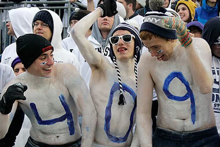 Penn State fans celebrated another historic win for Joe Paterno. (Gene J. Puskar/AP)