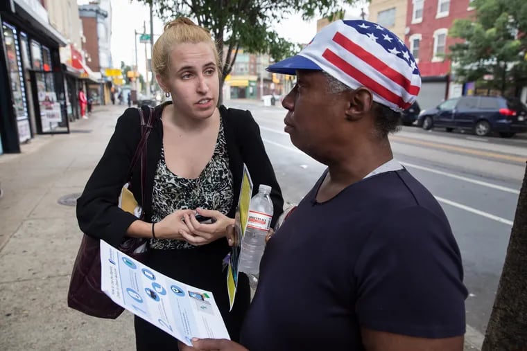 Allison Herens, left, a Harm Reduction Coordinator for the Department of Public Health for the City of Philadelphia, talks with Kelly (last name withheld), about how and where to obtain Naloxone, in light of the recent number of overdoses attributed to fentanyl sold as crack cocaine, in West Philadelphia, Wednesday, June 27, 2018.