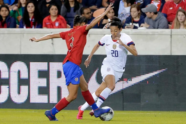 United States forward Christen Press (20) dribbles past Costa Rica defender Maria Coto (3) during the first half.