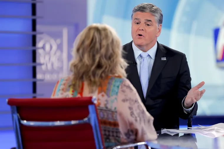 Fox News talk show host Sean Hannity interviews Roseanne Barr during a taping of his show, Thursday, July 26, 2018, in New York.