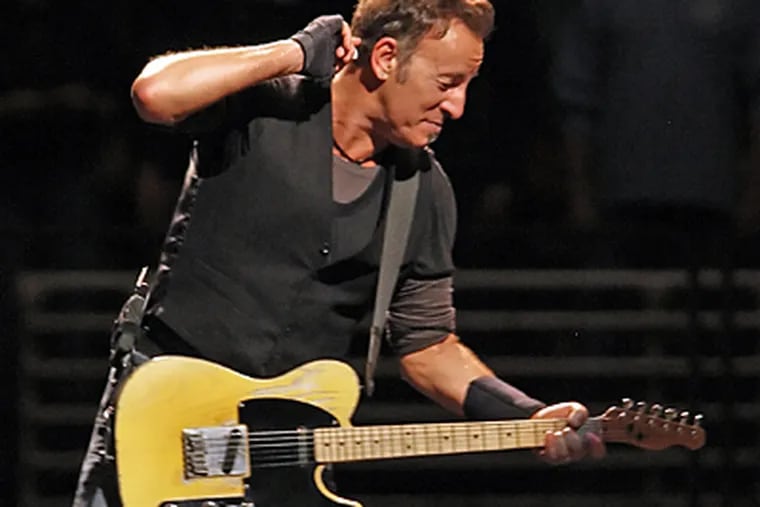 Bruce Springsteen performs during the first of four final concerts at the
Wachovia Spectrum. ( Steven M. Falk / Staff Photographer )