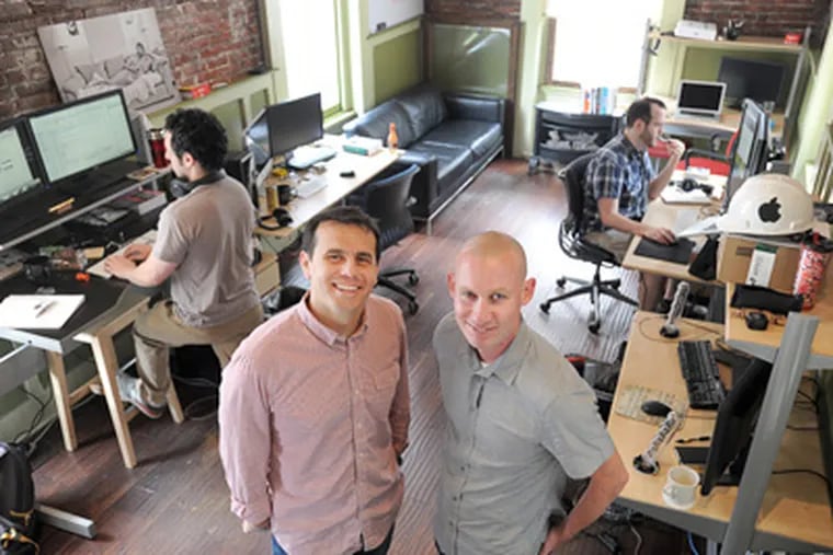 WebLinc chief executive Darren Hill (right) with director of business development Avery Amaya at one of the company’s Third Street work spaces. WebLinc, after rebounding from tough times, has grown to 82 employees. SHARON GEKOSKI-KIMMEL / Staff Photographer