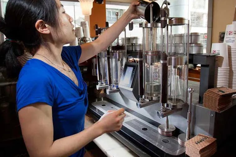 Barista Angie Chung works the Steampunk machine at La Colombe.