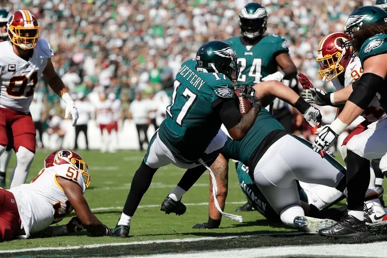 Eagles wide receiver Alshon Jeffery scores on a two-yard run Sunday in the Eagles' 32-27 win over Washington. Jeffery also caught a five-yard touchdown pass.